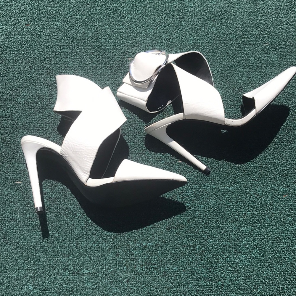 White heels with wide ankle wrap with adjustable buckle